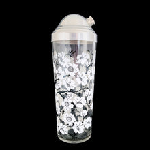 Load image into Gallery viewer, Vintage white Dogwood flower cocktail shaker with five matching glasses. Crafted by Hazel-Atlas Glass, USA, 1930s/40s. A wonderful Art Deco set to add to your barware collection!

In good used vintage condition, no chips or wear to the paint. Lid has age-related wear.

Shaker measures 3 1/4 x 10 1/4 inches, capacity 24 ounces

Glasses measures 2 3/8 x 3 3/4 inches, capacity 4 ounces
