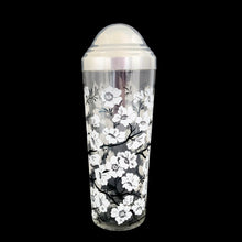 Load image into Gallery viewer, Vintage white Dogwood flower cocktail shaker with five matching glasses. Crafted by Hazel-Atlas Glass, USA, 1930s/40s. A wonderful Art Deco set to add to your barware collection!

In good used vintage condition, no chips or wear to the paint. Lid has age-related wear.

Shaker measures 3 1/4 x 10 1/4 inches, capacity 24 ounces

Glasses measures 2 3/8 x 3 3/4 inches, capacity 4 ounces

