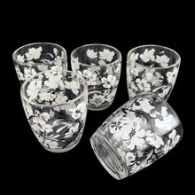 Load image into Gallery viewer, Vintage white Dogwood flower cocktail shaker with five matching glasses. Crafted by Hazel-Atlas Glass, USA, 1930s/40s. A wonderful Art Deco set to add to your barware collection!

In good used vintage condition, no chips or wear to the paint. Lid has age-related wear.

Shaker measures 3 1/4 x 10 1/4 inches, capacity 24 ounces

Glasses measures 2 3/8 x 3 3/4 inches, capacity 4 ounces
