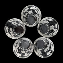 Load image into Gallery viewer, Vintage white Dogwood flower cocktail shaker with five matching glasses. Crafted by Hazel-Atlas Glass, USA, 1930s/40s. A wonderful Art Deco set to add to your barware collection!

In good used vintage condition, no chips or wear to the paint. Lid has age-related wear.

Shaker measures 3 1/4 x 10 1/4 inches, capacity 24 ounces

Glasses measures 2 3/8 x 3 3/4 inches, capacity 4 ounces
