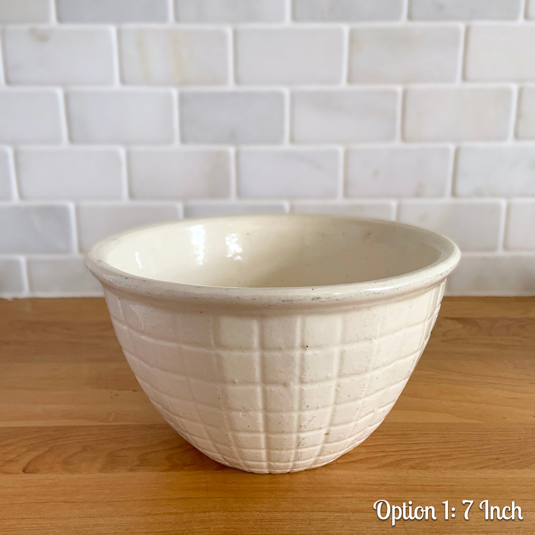 Vintage white embossed grid squares mixing bowl. Crafted by Robinson Ransbottom Pottery Co., 1950s. A well-crafted piece of stoneware offering a nostalgic vibe to your farmhouse or cottage kitchenware and decor!

Option 1: Capacity 2QTs. Measures 7 1/8 x 4 1/8 inches. In as found vintage condition, chips at the foot, age-related crazing, manufacturer's glaze pops. Unmarked.