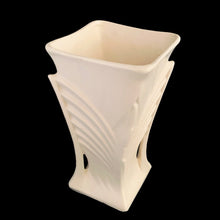 Load image into Gallery viewer, Exceptionally beautiful vintage matte white art deco vase, features a double fan design on a square trumpet shaped vase. Crafted by McCoy Pottery, 1943. This rare vase must for any art pottery collector!

In excellent vintage condition, no chips/cracks/repairs or noticeable crazing. Maker&#39;s mark on the bottom.

Measures 6 1/2 x 9 1/4 inches
