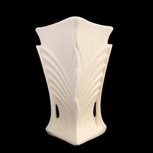 Load image into Gallery viewer, Exceptionally beautiful vintage matte white art deco vase, features a double fan design on a square trumpet shaped vase. Crafted by McCoy Pottery, 1943. This rare vase must for any art pottery collector!

In excellent vintage condition, no chips/cracks/repairs or noticeable crazing. Maker&#39;s mark on the bottom.

Measures 6 1/2 x 9 1/4 inches
