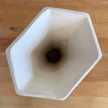 Load image into Gallery viewer, Vintage Art Deco matte white trumpet vase features a unique stretch hexagonal shape and asymmetric handles with leaf and berry motif. Crafted by Nelson McCoy Pottery, 1940s. This rare piece is must for any art pottery collector! A lovely way to enhance your home&#39;s decor or give as a gift!

In excellent vintage condition, no chips/cracks/repairs. Typical age-related crazing, manufacturer&#39;s glaze pops. Maker&#39;s mark.

Measures 5 1/2 x 4 1/4 x 8 inches
