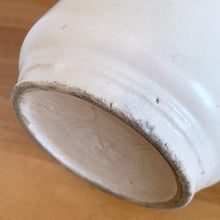 Load image into Gallery viewer, Vintage Art Deco matte white Butterfly Line cylinder vase. Crafted by Nelson McCoy Pottery, early 1940s. This rare piece is must for any art pottery collector! A lovely way to enhance your home&#39;s decor or give as a gift!

In good vintage condition, no chips/cracks/repairs. Heavy age-related crazing, manufacturer&#39;s glaze pops. Maker&#39;s marks.

Measures 4 3/8 x 8 1/8 inches
