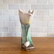 Load image into Gallery viewer, Rare vintage mid-century matte white double tulip vase. Crafted by McCoy Pottery, USA, 1948. This special piece is must for any art pottery collector!

In as found condition, with chip to leaf, no cracks/repairs. Maker&#39;s mark.

Measures 7 x 3 5/8 x 8 inches
