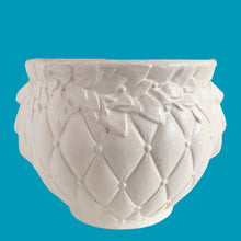 Load image into Gallery viewer, Large vintage Tierra Cushion jardiniere planter pot, aqua shiny glaze, features an overlapping floral leaf pattern around the top rim, a diamond quilted body and ribbon handles. Crafted by McCoy Pottery, USA, 1950s. A must-have for any McCoy collector or gardener!

In good vintage condition, free from chips, cracks or repairs, with crazing commensurate with age, see photos. Maker's mark is on the bottom.

Measures 8 3/4 x 7 1/2 inches
