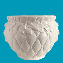 Load image into Gallery viewer, Large vintage Tierra Cushion jardiniere planter pot, aqua shiny glaze, features an overlapping floral leaf pattern around the top rim, a diamond quilted body and ribbon handles. Crafted by McCoy Pottery, USA, 1950s. A must-have for any McCoy collector or gardener!

In good vintage condition, free from chips, cracks or repairs, with crazing commensurate with age, see photos. Maker's mark is on the bottom.

Measures 8 3/4 x 7 1/2 inches
