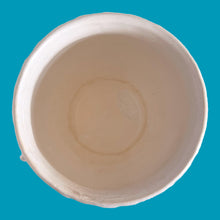Load image into Gallery viewer, Large vintage Tierra Cushion jardiniere planter pot, aqua shiny glaze, features an overlapping floral leaf pattern around the top rim, a diamond quilted body and ribbon handles. Crafted by McCoy Pottery, USA, 1950s. A must-have for any McCoy collector or gardener!

In good vintage condition, free from chips, cracks or repairs, with crazing commensurate with age, see photos. Maker's mark is on the bottom.

Measures 8 3/4 x 7 1/2 inches
