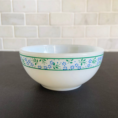 Vintage white milk glass cereal or soup with a band of vibrant blue flowers between two green bands. Produced by Termoscrisa Glass, Mexico. Circa 1980.  In excellent condition free from chips/cracks/wear.  Measures 5 x 2 1/4 inches