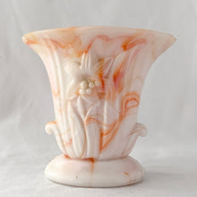 Load image into Gallery viewer, Vintage orange and white slag glass urn with embossed flower. Produced by Akro Agate, circa 1940s. These were produced for Jean Vivaudou Co. as packaging for their sachet products. Use as a bud vase or planter or repurpose to hold make-up brushes or pens/pencils.  In good vintage condition, with minor chips to the rim. Marked &quot;Made in the USA&quot;.   Measures 4 3/4 x 3 x 4 3/8 inches
