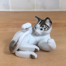 Load image into Gallery viewer, Delightful vintage playful cat porcelain figurine, style 0132 from the Classic Rose Collection. Crafted by Rosenthal, Germany. Add this sweet figurine to your collection!

In excellent condition, no chips/cracks.

Measures 2 1/4 x 2 x 1 1/2 inches
