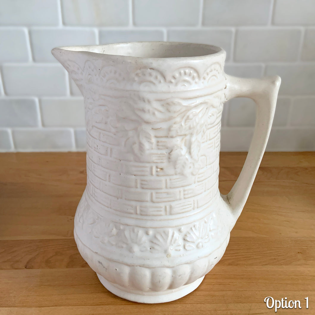 Antique vintage art deco matte white Rosella no. 320 ceramic yellow ware pitcher featuring climbing roses on a basketweave pattern. Crafted by Robinson Ransbottom Pottery Co., USA, 1920s. A beautiful piece of art pottery to add to collection. Makes a wonderful vessel for a floral arrangement.

Option 1: 6 1/2 x 7 5/8 inches
In excellent vintage condition, no chips/cracks/repairs, age-related crazing and typical manufacturing glaze pops. Maker's mark.