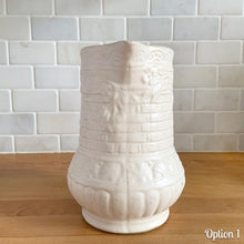 Load image into Gallery viewer, Antique vintage art deco matte white Rosella no. 320 ceramic yellow ware pitcher featuring climbing roses on a basketweave pattern. Crafted by Robinson Ransbottom Pottery Co., USA, 1920s. A beautiful piece of art pottery to add to collection. Makes a wonderful vessel for a floral arrangement.

Option 1: 6 1/2 x 7 5/8 inches
In excellent vintage condition, no chips/cracks/repairs, age-related crazing and typical manufacturing glaze pops. Maker&#39;s mark.

