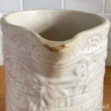 Load image into Gallery viewer, Antique vintage art deco matte white Rosella no. 320 ceramic yellow ware pitcher featuring climbing roses on a basketweave pattern. Crafted by Robinson Ransbottom Pottery Co., USA, 1920s. A beautiful piece of art pottery to add to collection. Makes a wonderful vessel for a floral arrangement.

Option 2: 6 1/2 x 7 5/8 inches
In as found vintage condition, chips to the spout, no cracks/repairs, age-related crazing and typical manufacturing glaze pops. Maker&#39;s mark.
