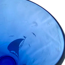 Load image into Gallery viewer, This iconic vintage cobalt blue glass cocktail shaker features white sailboats and sea birds, topped with a chrome lid. Crafted by Hazel-Atlas Glass, USA, 1930s. Reclaim the pleasure of being your home&#39;s star bartending mixologist...no Googling required!

In great vintage condition, no chips. The glass and lid shows age-related wear.

Measures 3 3/4 x 9 3/4 inches

Capacity 24 ounces
