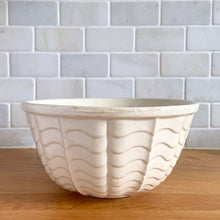 Load image into Gallery viewer, Vintage glossy white ceramic mixing bowl with an exterior pattern of horizontal waves. Crafted by Robinson Ransbottom Pottery Co., USA, 1960s. A beautiful piece to add to your kitchen&#39;s art pottery collection!

In excellent condition, no chips/cracks/repairs, wear to the rim. Maker&#39;s marks.

Measures 8 1/4 x 4 1/4 inches
