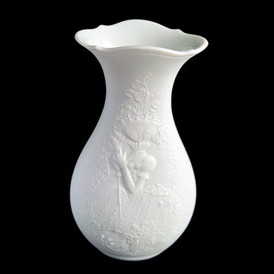 Vintage white bisque porcelain flower vase features an embossed queen of flowers, pattern 631. Designed by M. Frey for Kaiser, Germany, 1970s. This delicate vase will look stunning in any setting!

In excellent condition, no chips/cracks/repairs. Maker's mark on bottom.

Measures 3 1/2 x 6 1/2 inches