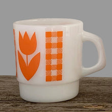 Load image into Gallery viewer, Vintage milk glass mug with vibrant orange tulip flowers and gingham check bands. Crafted by Termoscrisa Glass, Mexico. Circa 1980s. Perfect for your cuppa Joe!  In excellent condition, no chips/wear.  Measures 3 x 3 3/8 inches. Capacity 8 ounces
