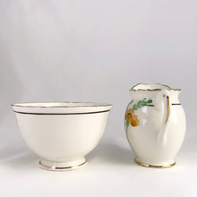 Load image into Gallery viewer, Vintage bone china wild flowers creamer and sugar, featuring hand painted florals in shades of pink, blue, yellow and green with gold gilt trim and scalloped edges. Crafted by Delphine China, England, 1920s. A lovely way to enhance your tea and coffee experience!

In excellent condition, no chips, cracks or repairs. Maker&#39;s mark on the bottom.

Creamer measures 1 7/8 x 2 3/4 inches | Sugar measures 3 5/8 x 2 1/4 inches
