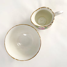 Load image into Gallery viewer, Vintage bone china wild flowers creamer and sugar, featuring hand painted florals in shades of pink, blue, yellow and green with gold gilt trim and scalloped edges. Crafted by Delphine China, England, 1920s. A lovely way to enhance your tea and coffee experience!

In excellent condition, no chips, cracks or repairs. Maker&#39;s mark on the bottom.

Creamer measures 1 7/8 x 2 3/4 inches | Sugar measures 3 5/8 x 2 1/4 inches
