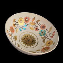 Load image into Gallery viewer, Vintage Wildwood footed metal bowl, shape 64/CD18 features a lovely patten of florals in tea, orange, brown and gold on a cream ground. Crafted by Baret Ware Bowls, England, 1960s. A lovely decorative to use as a catchall, fruit display or decor.

In vintage condition with patina and wear commensurate with age, minor rust under the rolled rim.

Measures 7 1/4 x 3 3/8 inches
