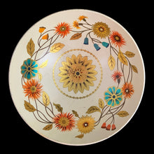 Load image into Gallery viewer, Vintage Wildwood footed metal bowl, shape 64/CD18 features a lovely patten of florals in tea, orange, brown and gold on a cream ground. Crafted by Baret Ware Bowls, England, 1960s. A lovely decorative to use as a catchall, fruit display or decor.

In vintage condition with patina and wear commensurate with age, minor rust under the rolled rim.

Measures 7 1/4 x 3 3/8 inches
