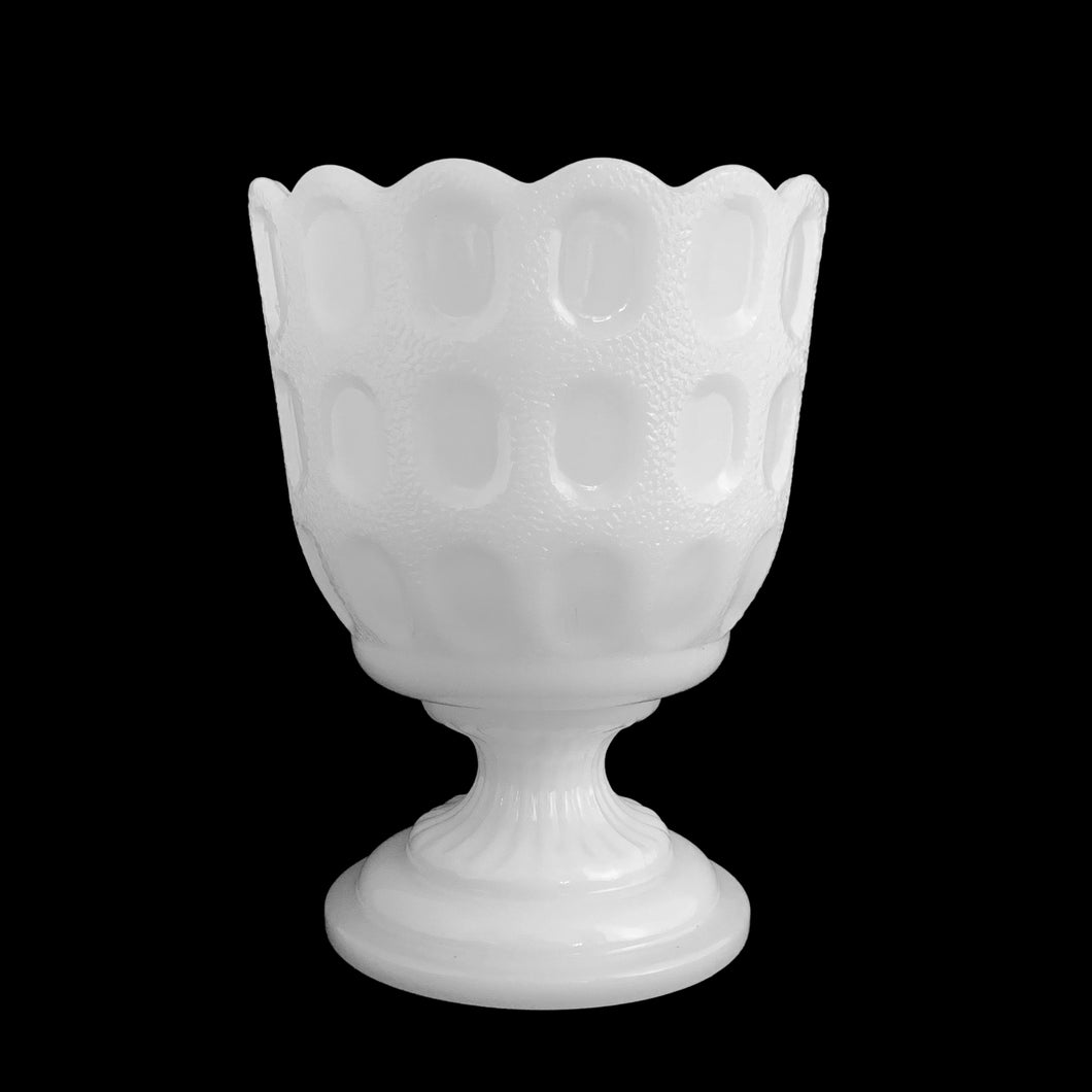 Bring classic charm to your space with this vintage mid-century white milk glass footed planter! Its stunning window pane design with scalloped edge creates a timeless look perfect for adding a touch of sophistication to any room. Let this planter bring timeless style to your home!  In excellent condition, free from chips.  Measures 4 1/2 x 6 inches   