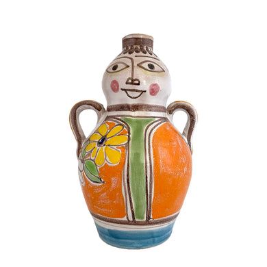 Vintage Giovanni de Simone art pottery handled bottle or vase featuring a Picasso-like style colourful portrait of a woman in orange with yellow flower. Crafted by de Simone Pottery, Italy, 1960s. Highly collectible, this charming piece will make a wonderful addition to your home's decor and pottery collection!

Excellent condition, no chips, cracks or repairs. Signed on the bottom DESIMONE with number 03.

Measures 5 1/2 x 8 inches