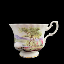 Load image into Gallery viewer, This vintage bone china footed teacup and saucer is so sweet! Both the cup and saucer are decorated with a woodland country scene with pink flowers. Each piece has a lovely scalloped shape, trimmed with gold gilt. Produced by Richmond, England, 1950s-70s.

In excellent condition, no chips, cracks or repairs. Maker&#39;s mark on the bottom.

Teacup measures 3 1/2 x 2 3/4 inches | Saucer measures 5 1/2 inches
