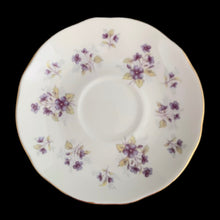 Load image into Gallery viewer, Vintage Woodside white bone china teacup and saucer features purple violets, trimmed in gold gilt. Crafted by Duchess, England, 1960s. A lovely way to enjoy a cuppa tea!

In excellent condition, no chips, cracks or repairs. Maker&#39;s mark on the bottom.

Measures 3 7/8 x 2 3/4 x 5 1/2 inches
