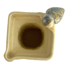 Load image into Gallery viewer, Beautifully detailed, vintage Art Deco Flaxman Ware matte yellow glazed castle tower pitcher featuring a budgie bird atop the handle, along with purple and green florals. Crafted by Wade, Heath &amp; Co., England, 1930s. This decorative and highly collectible piece makes a lovely decor accent.

In good vintage condition with chip on the bottom of the foot, typical crazing. Maker&#39;s mark on the bottom.

Measures 5 x 4 x 7 3/4 inches
