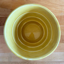 Load image into Gallery viewer, Highly collectible vintage mid-century yellow basketweave ceramic art pottery planter with attached underplate. Crafted by McCoy Pottery, USA, 1950s. The perfect home for your favourite houseplant or succulent!

In excellent vintage condition, no chips/cracks/repairs, age-related crazing. Maker&#39;s mark.

Measures 6 1/2 x 5 5/8 inches
