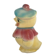 Load image into Gallery viewer, Vintage mid-century hand painted figural chick ceramic cookie jar, hand painted in shades of yellow, wearing a pink and blue jacket with black stitching and topped with a blue and pink beret. Crafted by American Bisque, USA, circa 1950s. Add some kitsch to your kitchen decor with this adorable collectible!

In excellent condition, minor chip on the underside of the foot, no cracks, age-related crazing.

Measures 6 x 7 x 11 3/4 inches
