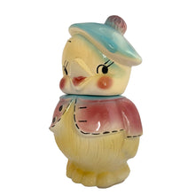 Load image into Gallery viewer, Vintage mid-century hand painted figural chick ceramic cookie jar, hand painted in shades of yellow, wearing a pink and blue jacket with black stitching and topped with a blue and pink beret. Crafted by American Bisque, USA, circa 1950s. Add some kitsch to your kitchen decor with this adorable collectible!

In excellent condition, minor chip on the underside of the foot, no cracks, age-related crazing.

Measures 6 x 7 x 11 3/4 inches
