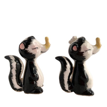 Load image into Gallery viewer, Vintage hand painted yellow clothespinned nose skunk salt and pepper shakers with cork stoppers. Norcrest, Japan, 1950s. Add these adorable kitschy shakers to your collection!

In excellent condition, no chips/cracks/repairs. Marked Japan.

Measures 2 1/4 x 1 1/8 x 2 5/8 inches
