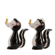 Load image into Gallery viewer, Vintage hand painted yellow clothespinned nose skunk salt and pepper shakers with cork stoppers. Norcrest, Japan, 1950s. Add these adorable kitschy shakers to your collection!

In excellent condition, no chips/cracks/repairs. Marked Japan.

Measures 2 1/4 x 1 1/8 x 2 5/8 inches
