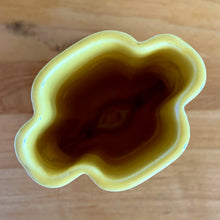 Load image into Gallery viewer, Vintage Art Deco yellow vase features a unique shape and double leaf decorative handles, 105. Crafted by McCoy Pottery, 1940s. This rare piece is must for any art pottery collector! A lovely way to enhance your home&#39;s decor or give as a gift!

In excellent vintage condition, no chips/cracks/repairs. Typical age-related crazing, manufacturer&#39;s glaze pops. Unmarked.

Measures 4 x 2 1/8 x 5 1/2 inches

