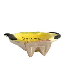 Load image into Gallery viewer, Adorable vintage mid-century hand painted figural ceramic yellow teapot teabag holder dish featuring the inscription &quot;I will hold the teabag&quot; atop a smiling face. The teabag holder can be displayed vertically when not in use as part of your kitsch kitchen decor....so cute!  In excellent condition, no chips/cracks/repairs. Marked &quot;Japan&quot;.  Measures 4 1/4 x 3 inches
