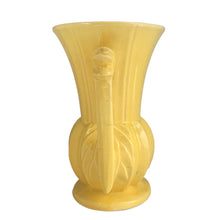 Load image into Gallery viewer, Exceptionally beautiful vintage gloss yellow art deco vase, features a melon base flowing into a trumpet shape finished with leaf topped handles. Crafted by McCoy Pottery, 1948. This rare vase must for any art pottery collector!

In as found vintage condition, no chips//repairs. There is a tight hairline crack on one of the handles and age-related crazing commensurate. Maker&#39;s mark on the bottom.

Measures 7 x 9 1/8 inches
