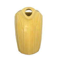Load image into Gallery viewer, Exceptional vintage gloss yellow art deco leaf wrapped pitcher with strap handle. Crafted by McCoy Pottery, 1949. This rare pitcher must for any art pottery collector!

In excellent vintage condition, no chips/crack/repairs, no noticeable crazing. Maker&#39;s mark on the bottom.

Measures 8 x 5 x 7 3/4 inches (incl. handle)

Capacity 55 ounces

