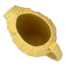 Load image into Gallery viewer, Exceptional vintage gloss yellow art deco leaf wrapped pitcher with strap handle. Crafted by McCoy Pottery, 1949. This rare pitcher must for any art pottery collector!

In excellent vintage condition, no chips/crack/repairs, no noticeable crazing. Maker&#39;s mark on the bottom.

Measures 8 x 5 x 7 3/4 inches (incl. handle)

Capacity 55 ounces
