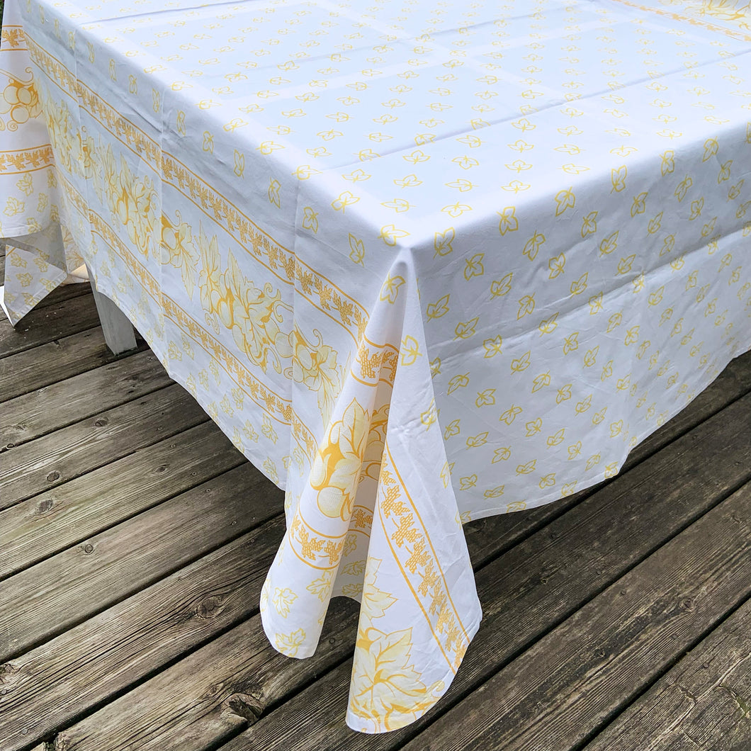 We are suckers for gorgeous linens and this piece does not disappoint! This large cotton tablecloth features a pattern of grapes and vines in shades of yellow. Made in Italy of 100% cotton. A lovely dress for your table!  This piece is new old stock and does not appear to have been used to laundered and is in excellent condition.   Measures 58 x 90 inches
