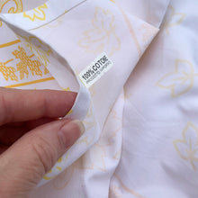 Load image into Gallery viewer, We are suckers for gorgeous linens and this piece does not disappoint! This large cotton tablecloth features a pattern of grapes and vines in shades of yellow. Made in Italy of 100% cotton. A lovely dress for your table!  This piece is new old stock and does not appear to have been used to laundered and is in excellent condition.   Measures 58 x 90 inches
