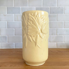 Load image into Gallery viewer, Vintage Art Deco matte yellow Butterfly Line cylinder vase. Crafted by Nelson McCoy Pottery, early 1940s. This rare piece is must for any art pottery collector! A lovely way to enhance your home&#39;s decor or give as a gift!

In good vintage condition, no chips/cracks/repairs. Heavy age-related crazing, manufacturer&#39;s glaze pops. Maker&#39;s marks.

Measures 4 3/8 x 8 1/8 inches
