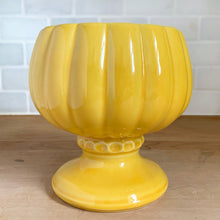 Load image into Gallery viewer, Side view of vintage McCoy Floraline yellow pedestal planter #401 showing fluted ribbed body, beaded collar detail at base of bowl, and wide circular foot
