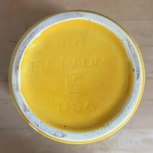 Load image into Gallery viewer, Bottom of vintage McCoy Floraline yellow planter #401 showing impressed "Floraline / LCC / USA" maker's mark on unglazed foot ring
