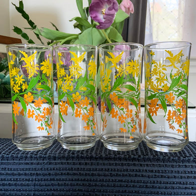 Fantastic four! These cooler glasses are decorated with yellow, orange and green flowers along with a sweet hummingbird. Produced by Libbey Glass Company, USA, circa 1970s. Fill these beauties with your favourite beverage and enjoy!  Measures 6 1/2 inches  Capacity 16 ounces