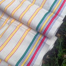 Load image into Gallery viewer, Vintage&nbsp;cream linen with yellow, red and green stripes deck chair fabric remnant. Made in France. Perfect for crafting and home decor projects.  In excellent condition, no stains/tears.  Measures 16 1/2 x 104 inches
