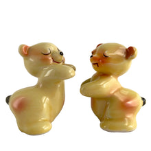 Load image into Gallery viewer, Vintage hand painted yellow Snuggle Hugs hugging bears salt and pepper shakers. Designed by Ruth Van Tellinger, USA, 1940s. Add these adorable kitschy shakers to your collection!

In excellent condition, no chips/cracks/repairs. Impressed maker&#39;s mark on the bottom.

Measures 2 3/8 x 2 3/4 x 3 3/8 inches
